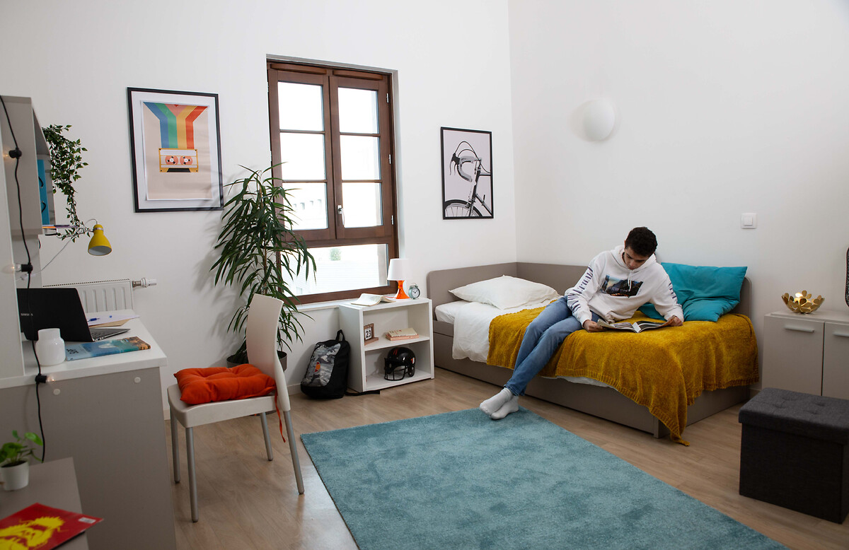 Student or young professional reading in his accomodation for students and young professionals Paris Bagnolet