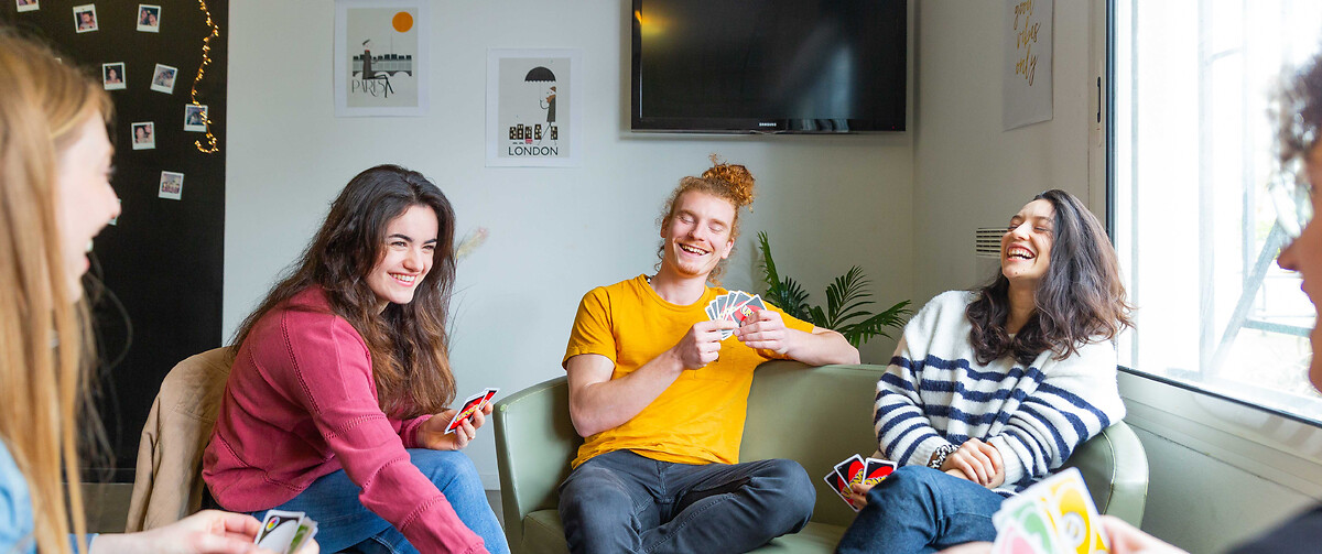 Card game in the lounge of the residence for students and young professionals Talence Centre